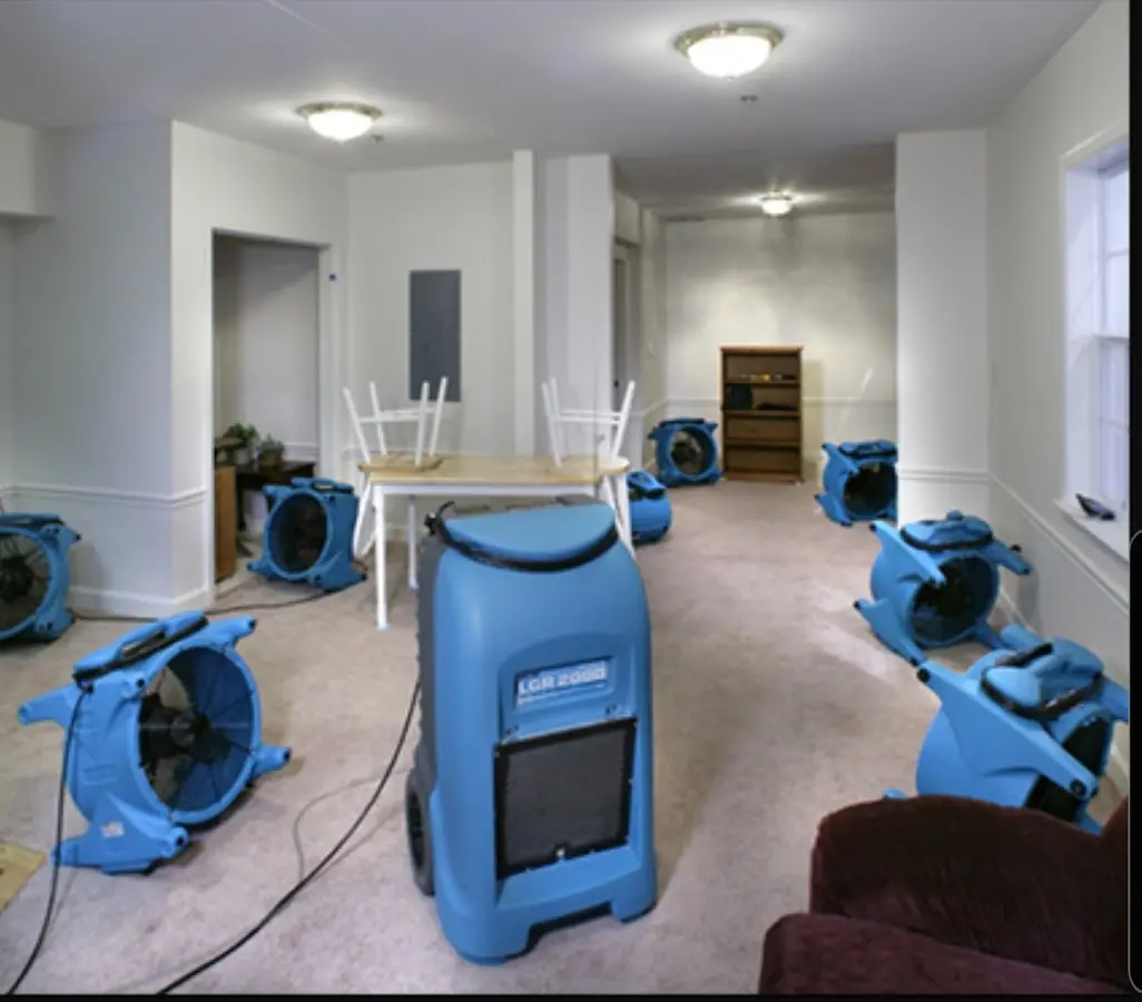 Air movers and dehumidifier setup for Water Damage Restoration in West University Place